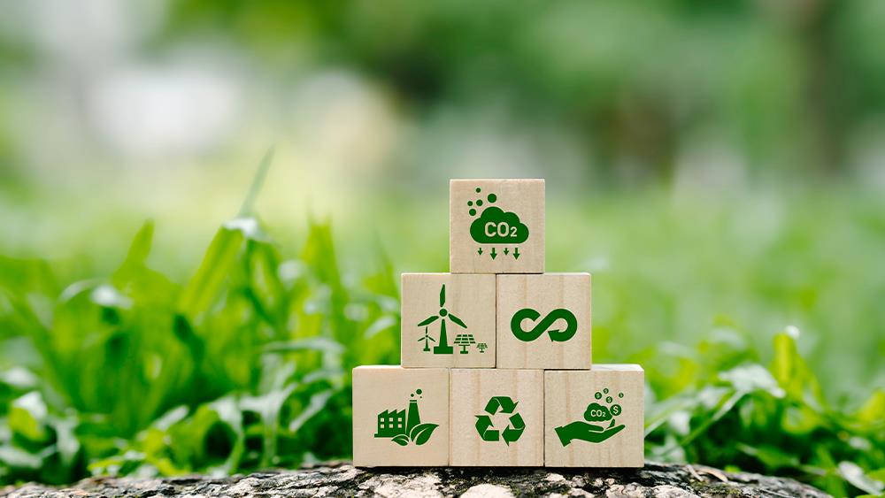 Image depicts the building blocks of the concept of sustainability, encompassing CO2 emissions, renewable energy, recycling and the principle of circular economy